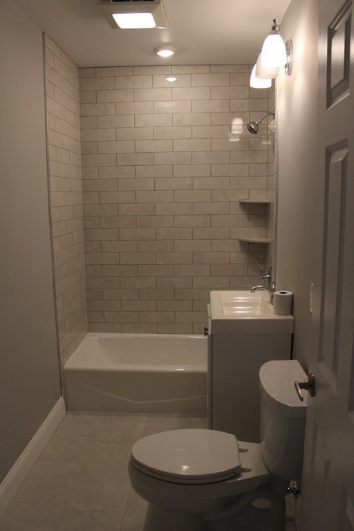 81 Alder Street Waltham, MA 02453 - Photo 17 of 38 a bathroom with a toilet and a shower