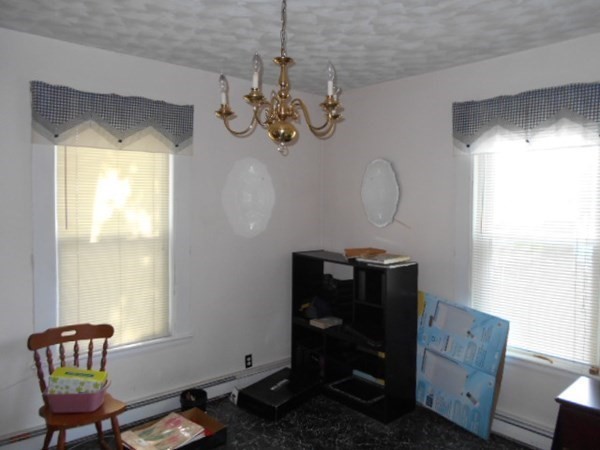 81 Alder Street Waltham, MA 02453 - Photo 23 of 38 a view of a livingroom with furniture and a window