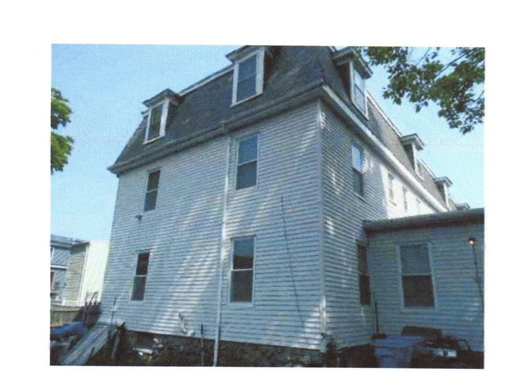 81 Alder Street Waltham, MA 02453 - Photo 26 of 38 a view of a house with a backyard