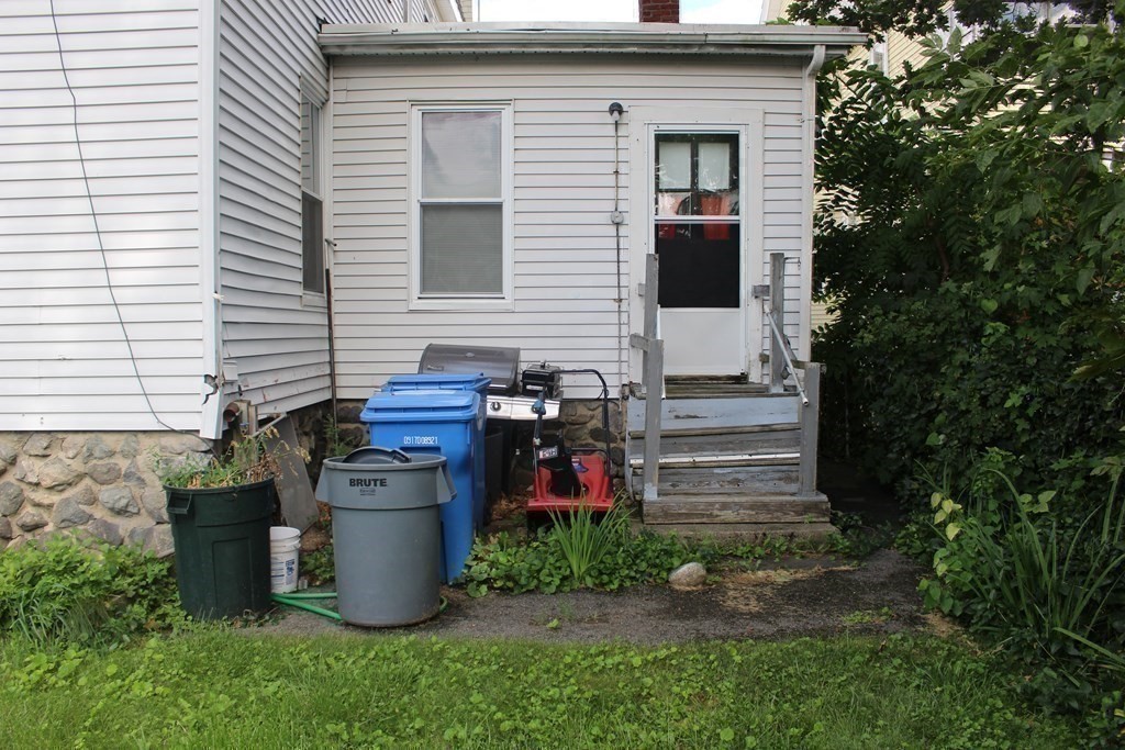 81 Alder Street Waltham, MA 02453 - Photo 27 of 38 a view of a backyard with seating space