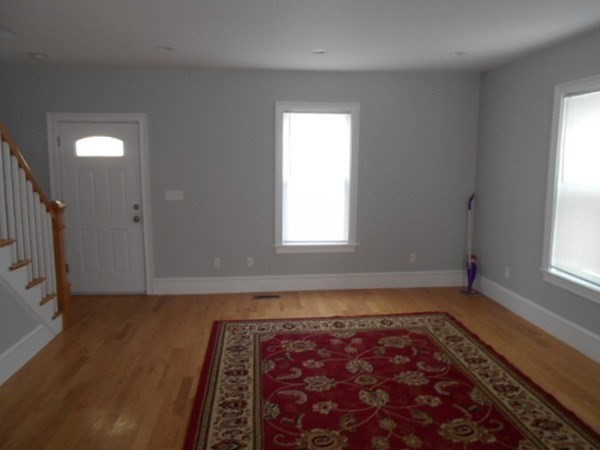 81 Alder Street Waltham, MA 02453 - Photo 4 of 38 wooden floor in an empty room with a window