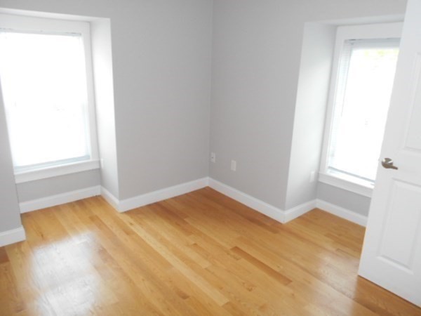 81 Alder Street Waltham, MA 02453 - Photo 10 of 38 a view of an empty room and window