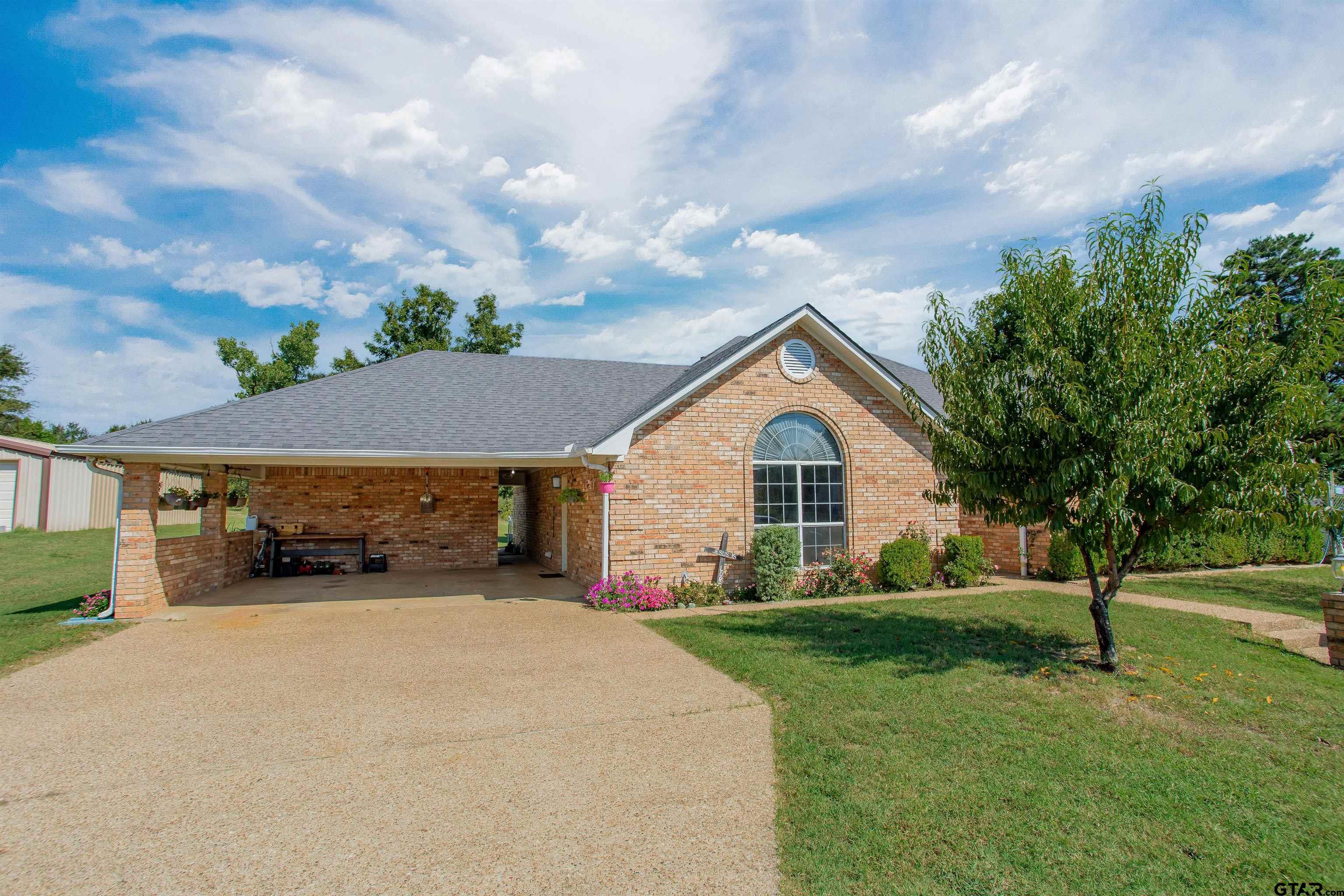 149 Pecan Street Frankston, TX 75763 - Photo 11 of 35 a view of a house with a yard and fence