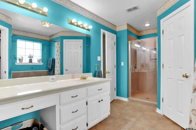 a bathroom with a tub and a sink