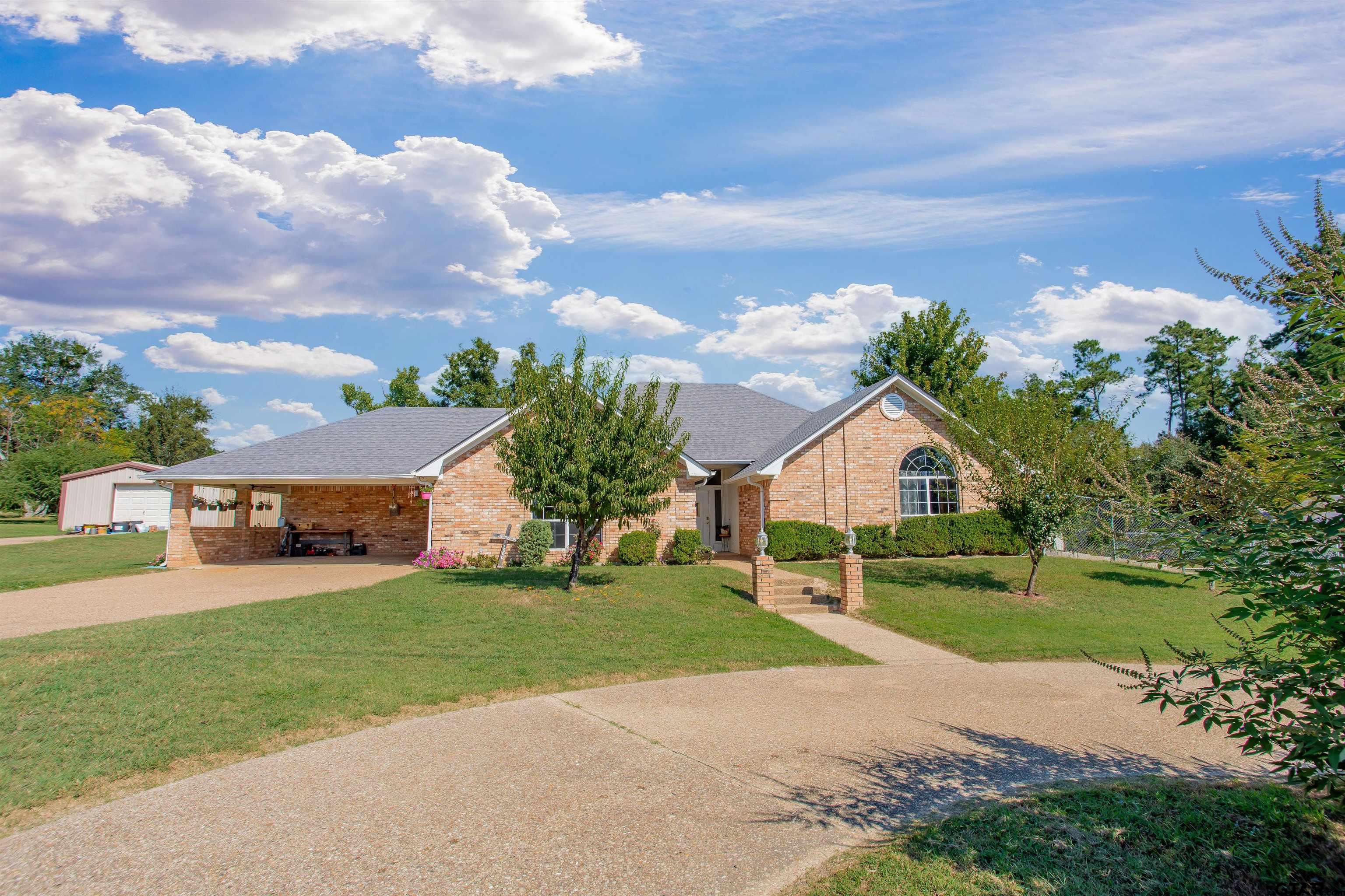 149 Pecan Street Frankston, TX 75763 - Photo 31 of 35 a view of a house with a big yard and a large trees