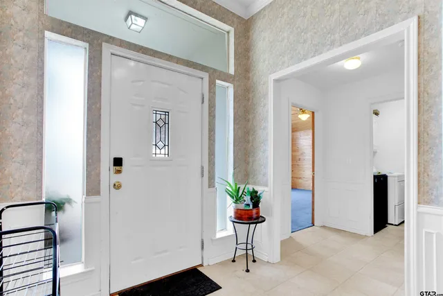 a view of a hallway and interior of a house