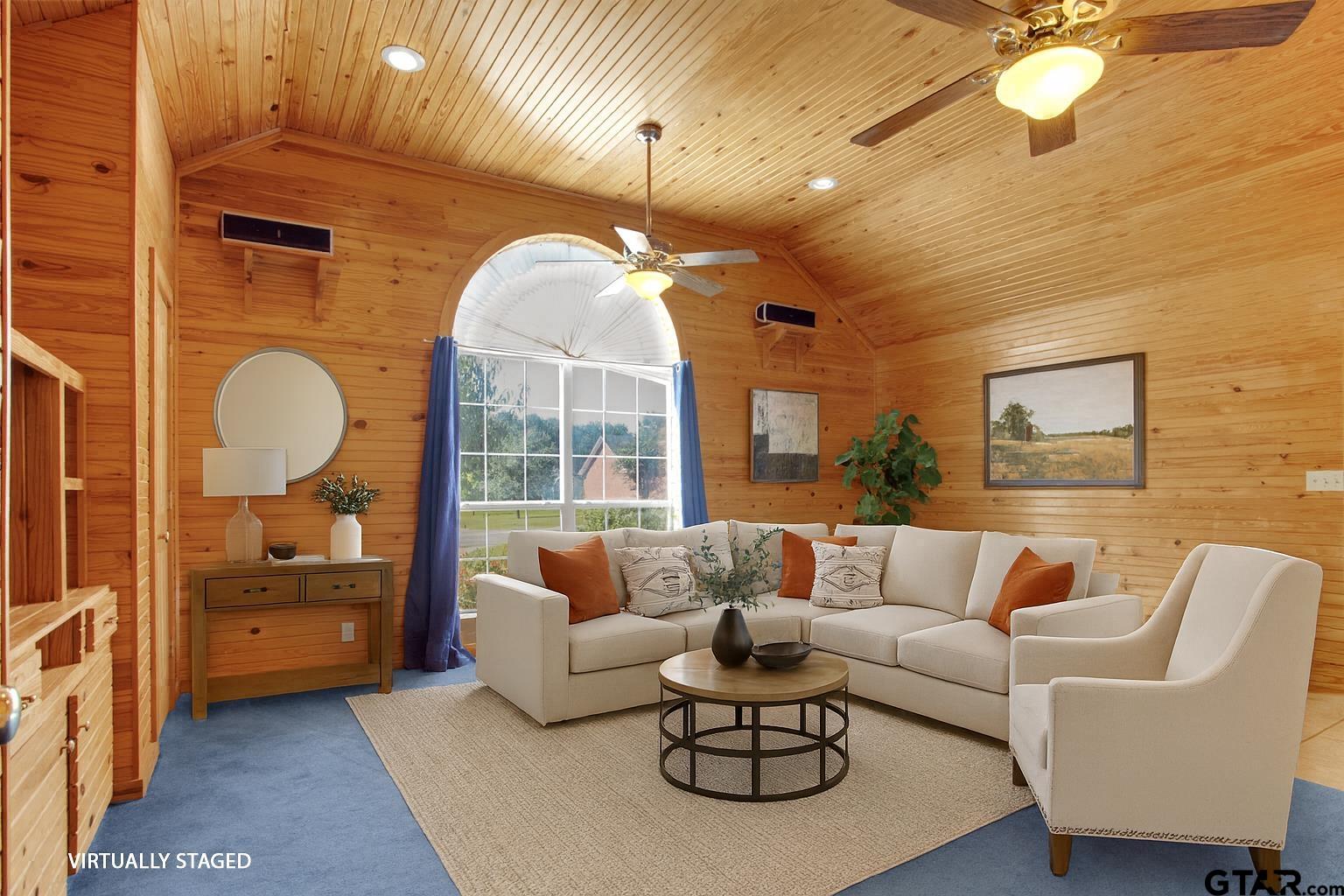 149 Pecan Street Frankston, TX 75763 - Photo 8 of 35 a living room with furniture a rug and a chandelier