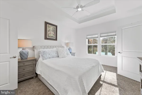 a bedroom with a large bed and a flat screen tv