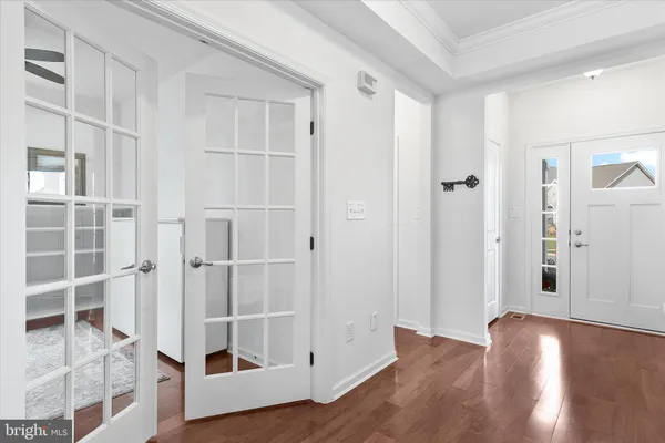 a kitchen with stainless steel appliances granite countertop a stove a sink dishwasher and a refrigerator with wooden cabinets