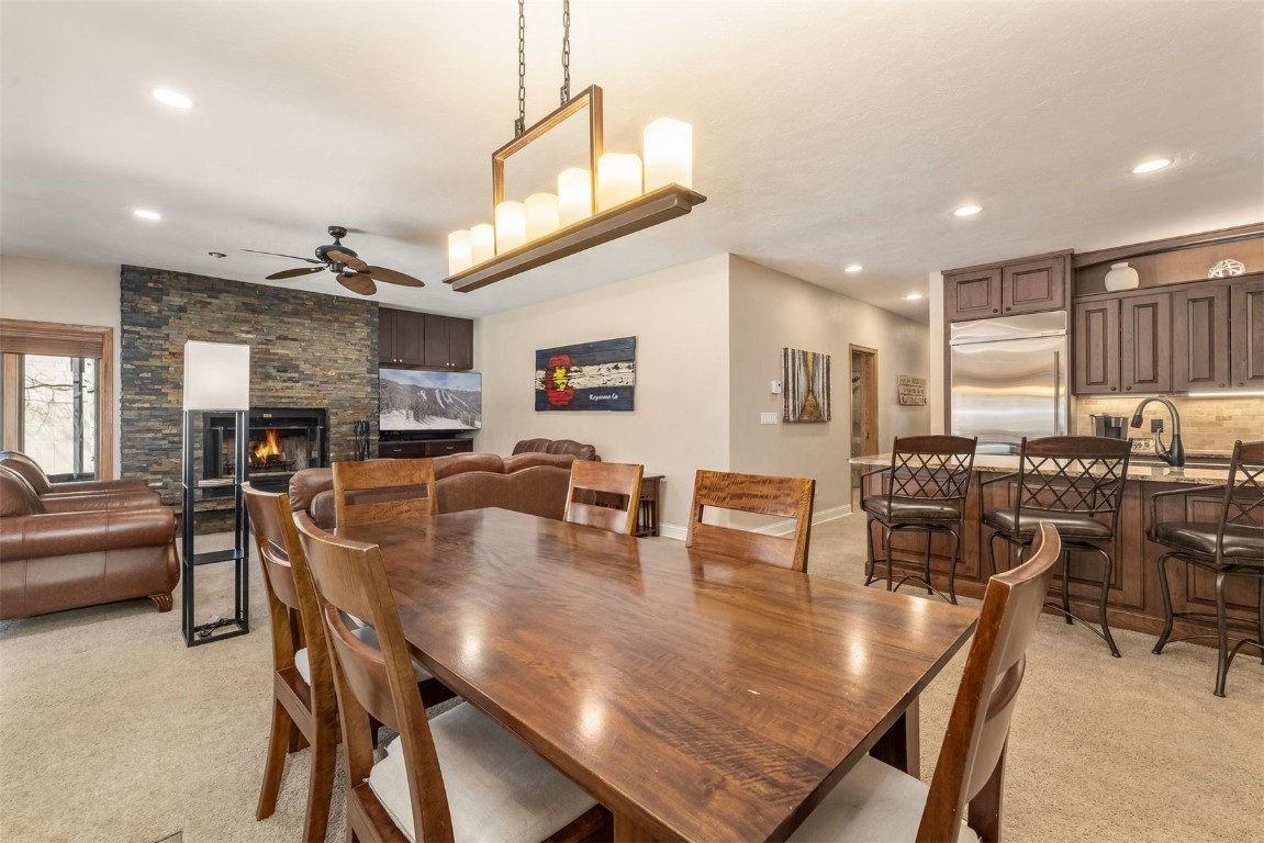 1203 West Keystone Road, Unit 2709 Keystone, CO 80435 - Photo 41 of 48 Dining space featuring a fireplace, light colored carpet, a ceiling fan, recessed lighting, and baseboards