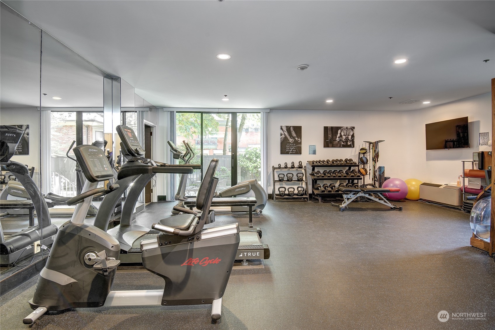 1120 Spring Street, Unit 1004 Seattle, WA 98104 - Photo 18 of 23 a view of a room with gym equipment