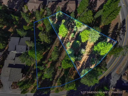 an outdoor space with swimming pool and green view