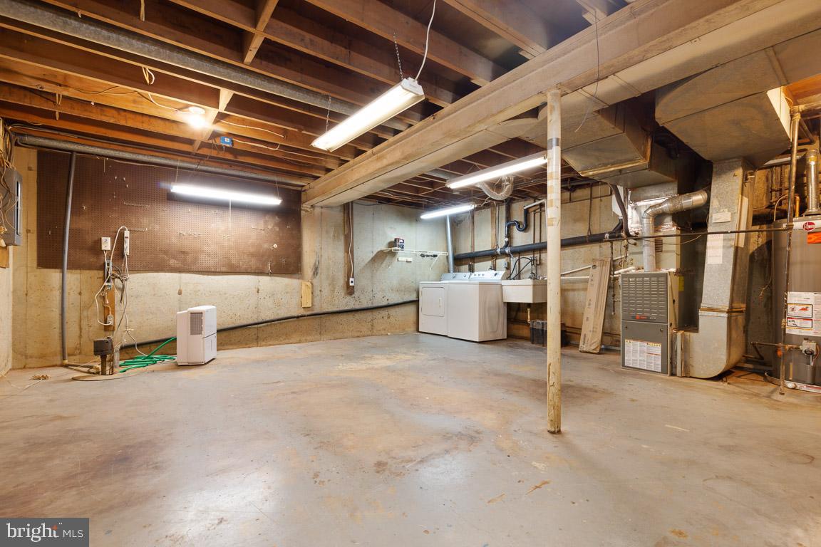 11715 Blue Smoke Trail Reston, VA 20191 - Photo 32 of 37 Unfinished work shop with laundry and sump pump