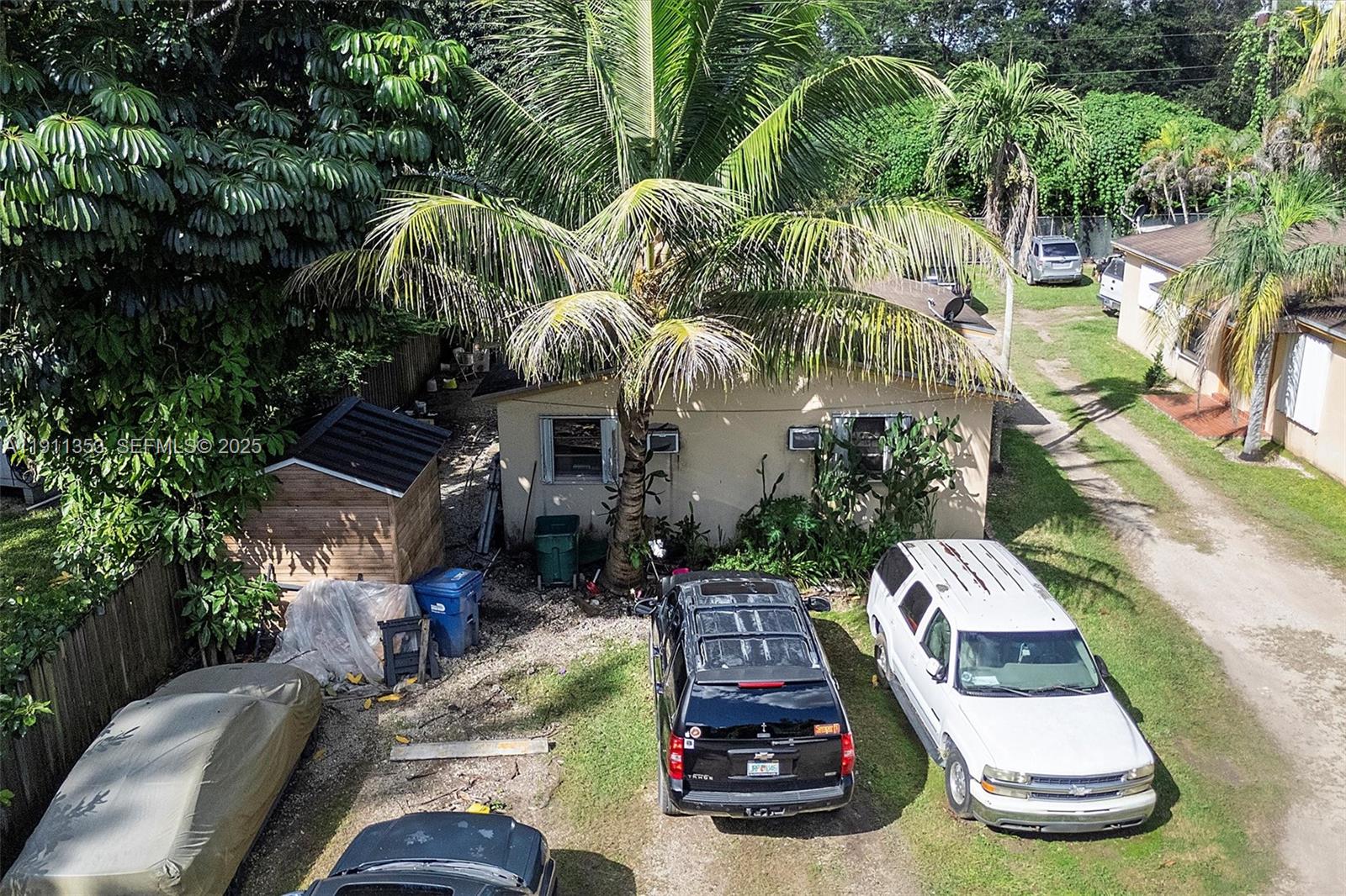 22950 Southwest 156th Avenue Miami, FL 33170 - Photo 4 of 11 a view of outdoor space with patio furniture and potted plants