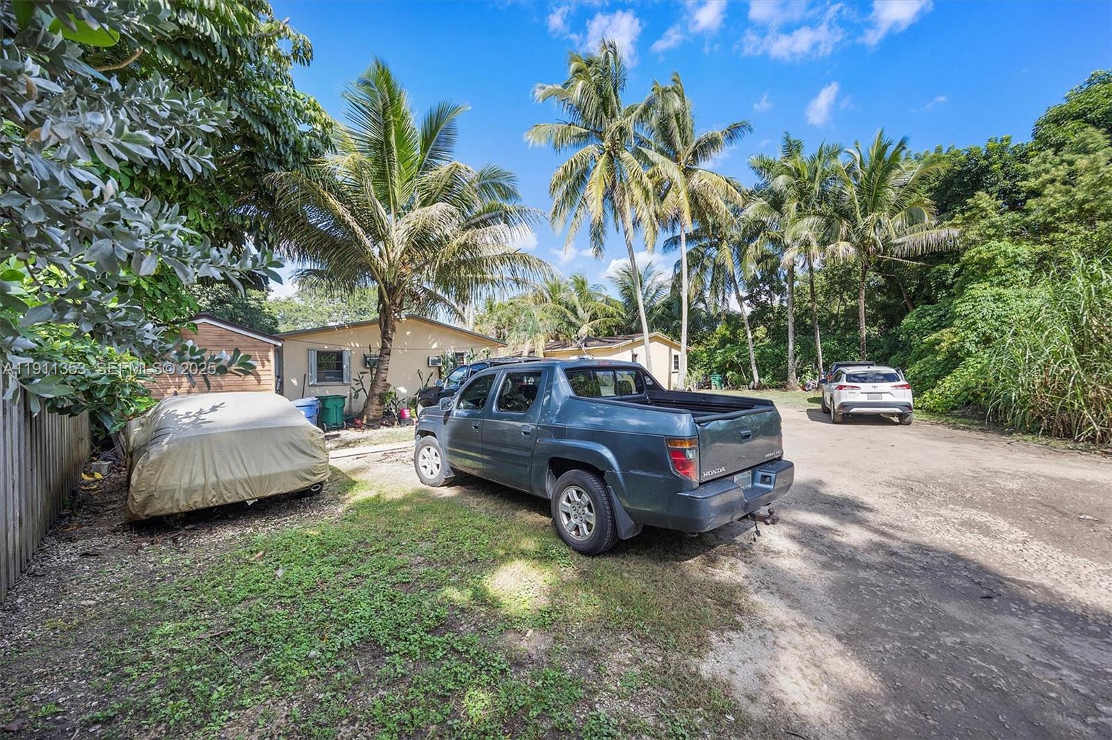 22950 Southwest 156th Avenue Miami, FL 33170 - Photo 7 of 11 a car parked in front of a house