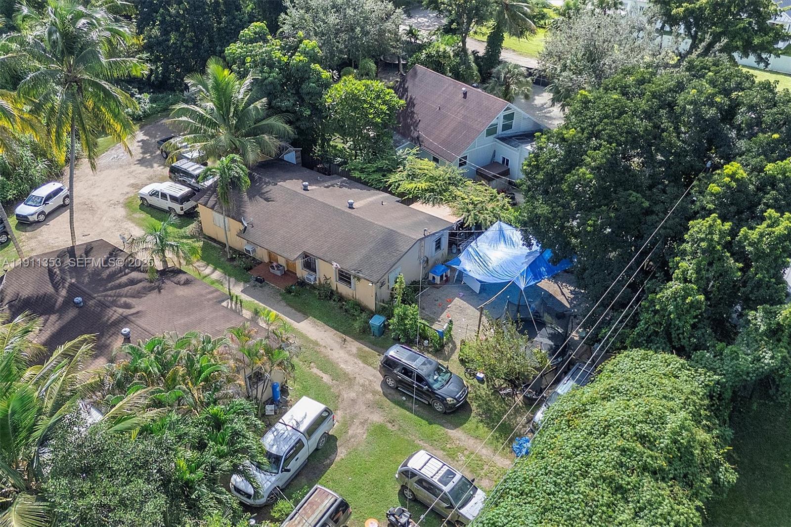 22950 Southwest 156th Avenue Miami, FL 33170 - Photo 8 of 11 an aerial view of a house with yard swimming pool and outdoor seating