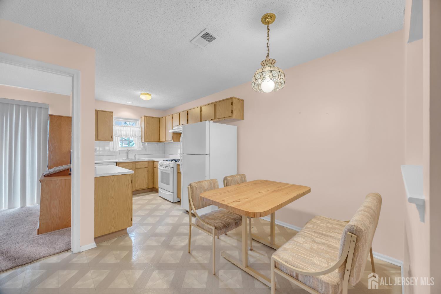 7 Gatley Close Freehold, NJ 07728 - Photo 13 of 36 a view of a dining room with furniture and wooden floor