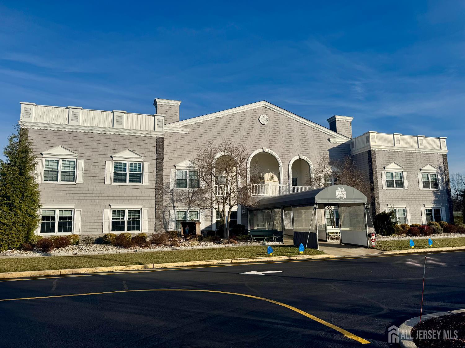 7 Gatley Close Freehold, NJ 07728 - Photo 33 of 36 a front view of a building with street view