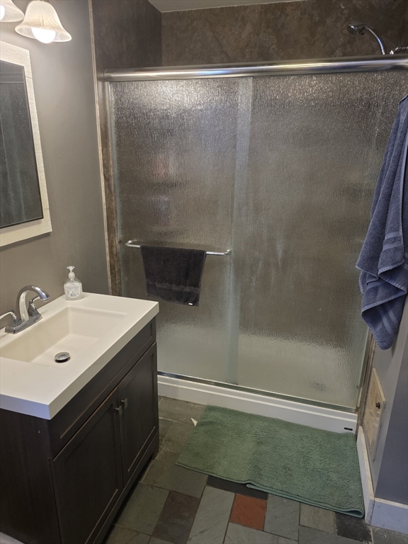 71 George Lamb Road Leyden, MA 01337 - Photo 11 of 18 a bathroom with a sink mirror and a shower