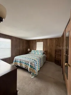 a bedroom with a bed and a cabinets