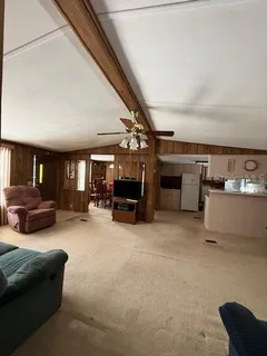 a view of a livingroom with furniture and windows