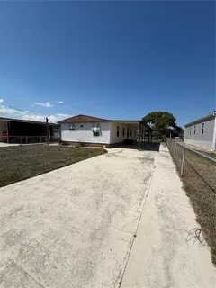 a view of a backyard of the house