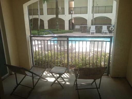 4112 Renaissance Way, Unit 112 Boynton Beach, FL 33426 - Photo 8 of 10 a view of a balcony with chairs