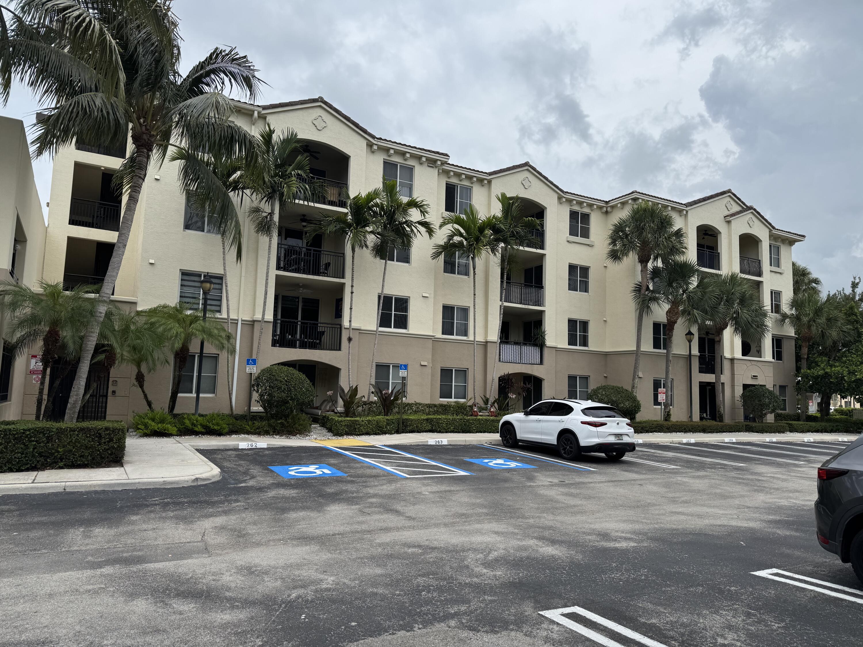 4112 Renaissance Way, Unit 112 Boynton Beach, FL 33426 - Photo 10 of 10 a car parked in front of a building