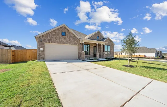 a house view with swimming pool and yard