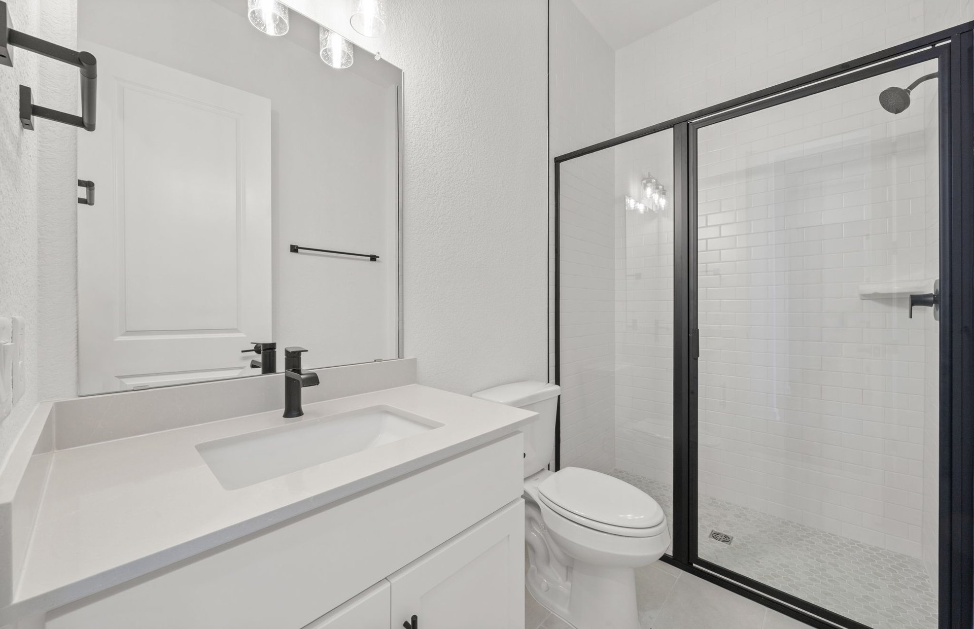 329 Muddy Creek Way Kyle, TX 78640 - Photo 16 of 22 a bathroom with a sink a toilet and shower