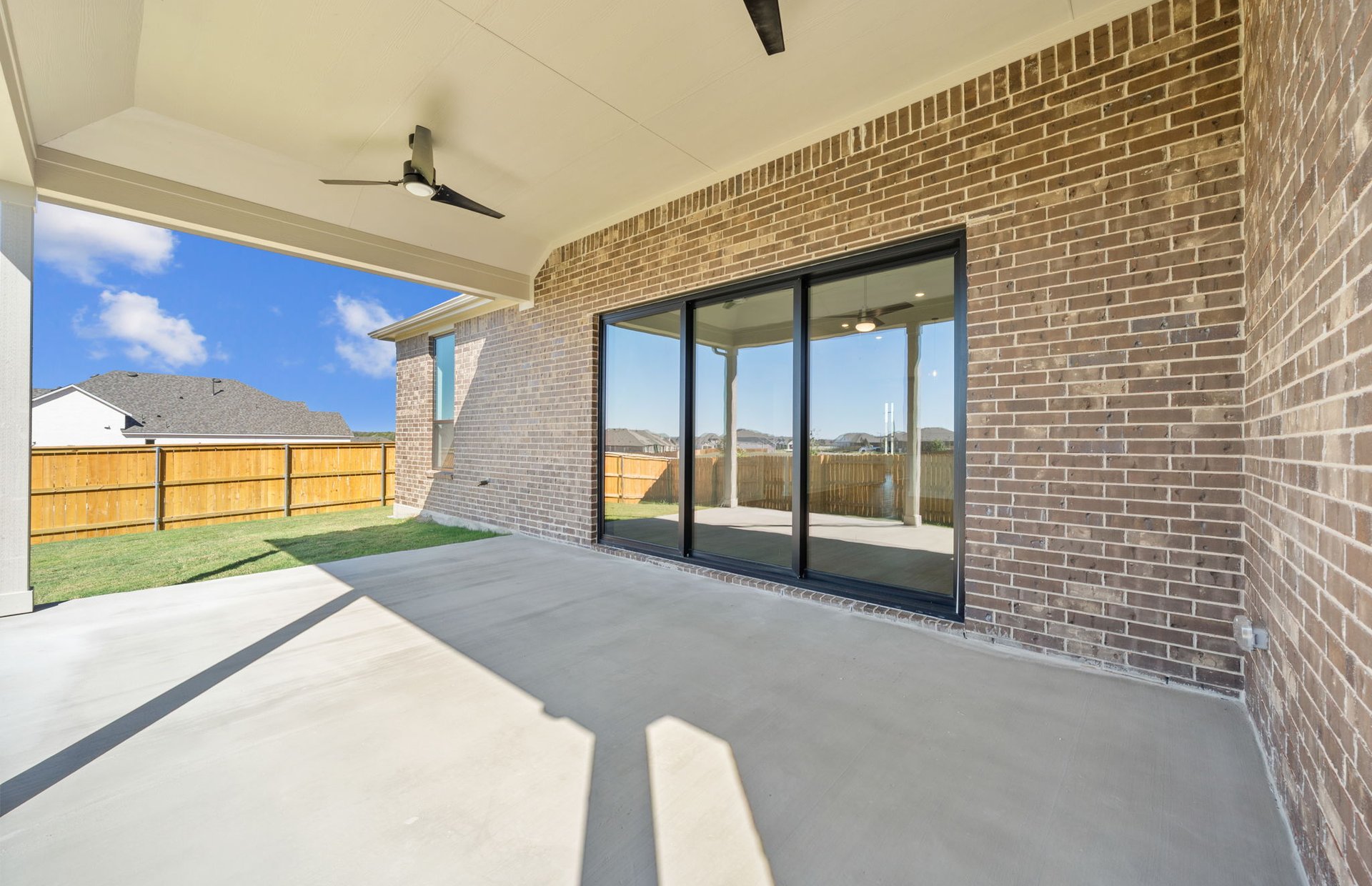 329 Muddy Creek Way Kyle, TX 78640 - Photo 21 of 22 a view of a porch with a table and chairs