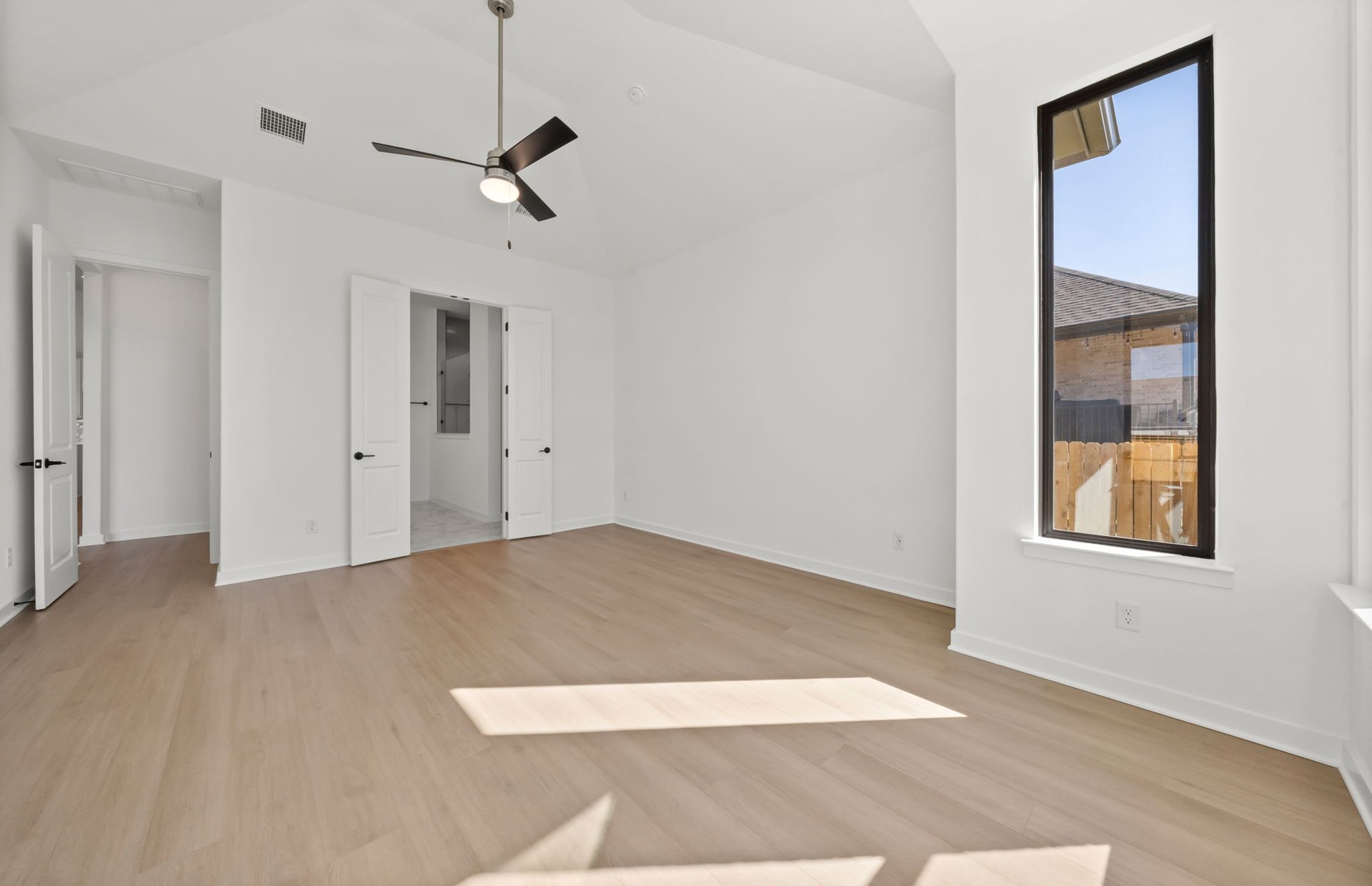 329 Muddy Creek Way Kyle, TX 78640 - Photo 9 of 22 an empty room with windows and closet