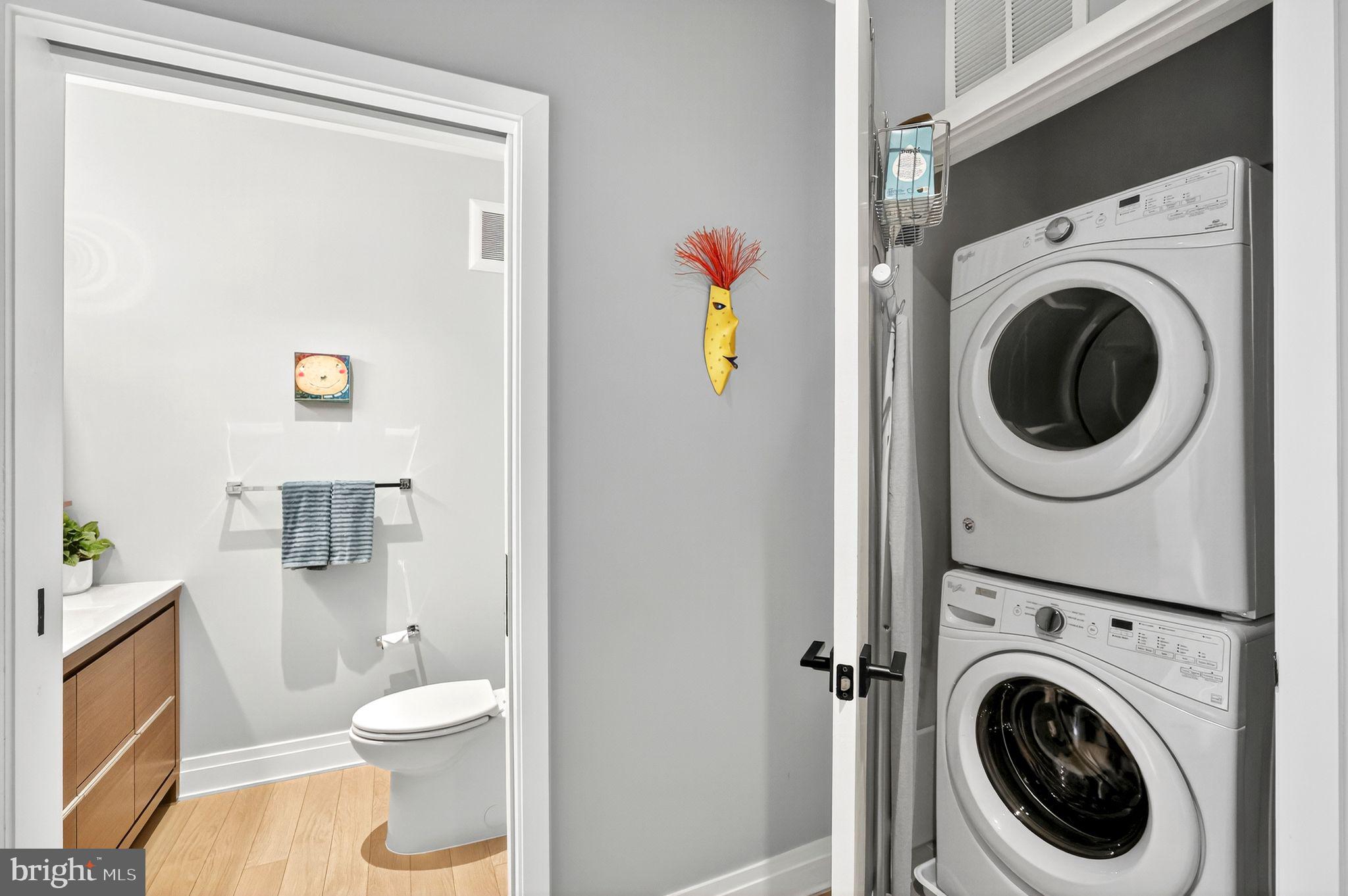 900 11th Street Southeast, Unit 308 Washington, DC 20003 - Photo 19 of 36 a view of a hallway with washer and dryer