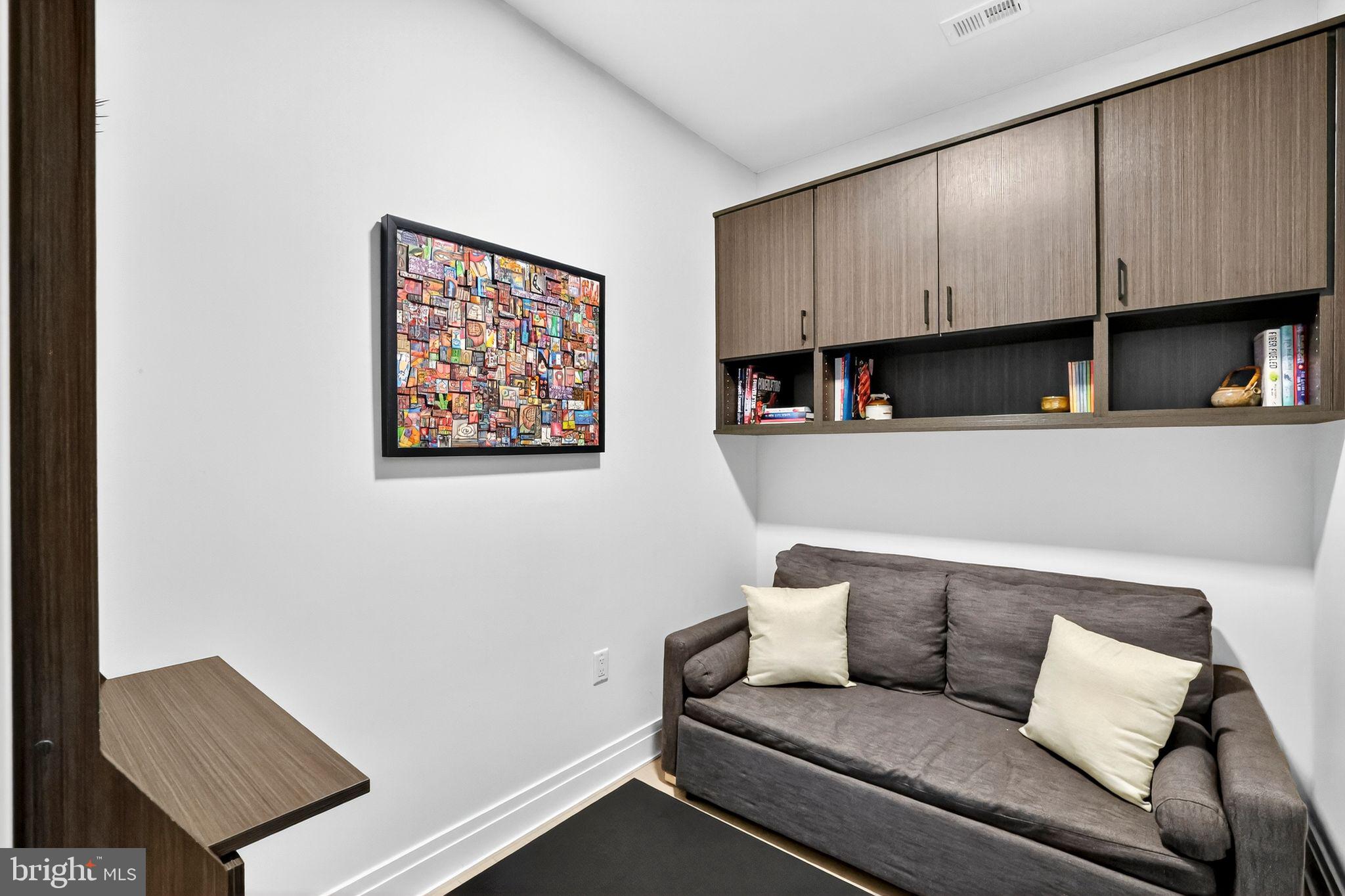 900 11th Street Southeast, Unit 308 Washington, DC 20003 - Photo 21 of 36 a living room with furniture and a couch