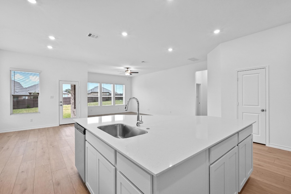 1617 Dove Rnch Road Georgetown, TX 78628 - Photo 25 of 25 a large white kitchen with sink and refrigerator