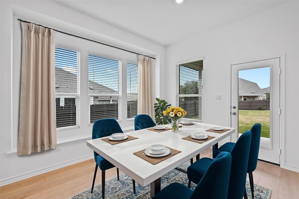 1617 Dove Rnch Road Georgetown, TX 78628 - Photo 9 of 25 a view of a dining room with furniture window and wooden floor