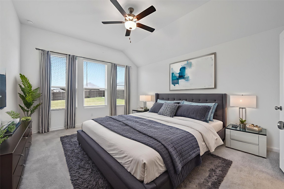 1617 Dove Rnch Road Georgetown, TX 78628 - Photo 12 of 25 a spacious bedroom with a large bed and a chandelier
