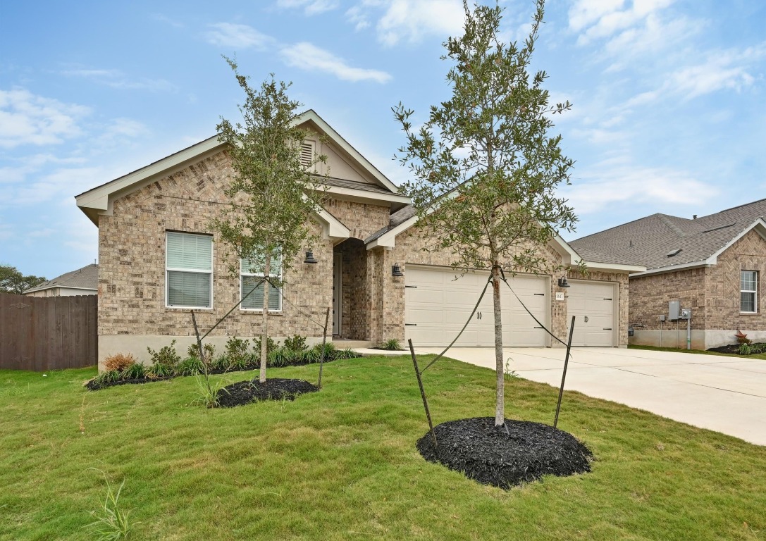 1617 Dove Rnch Road Georgetown, TX 78628 - Photo 2 of 25 a backyard of a house with table and chairs