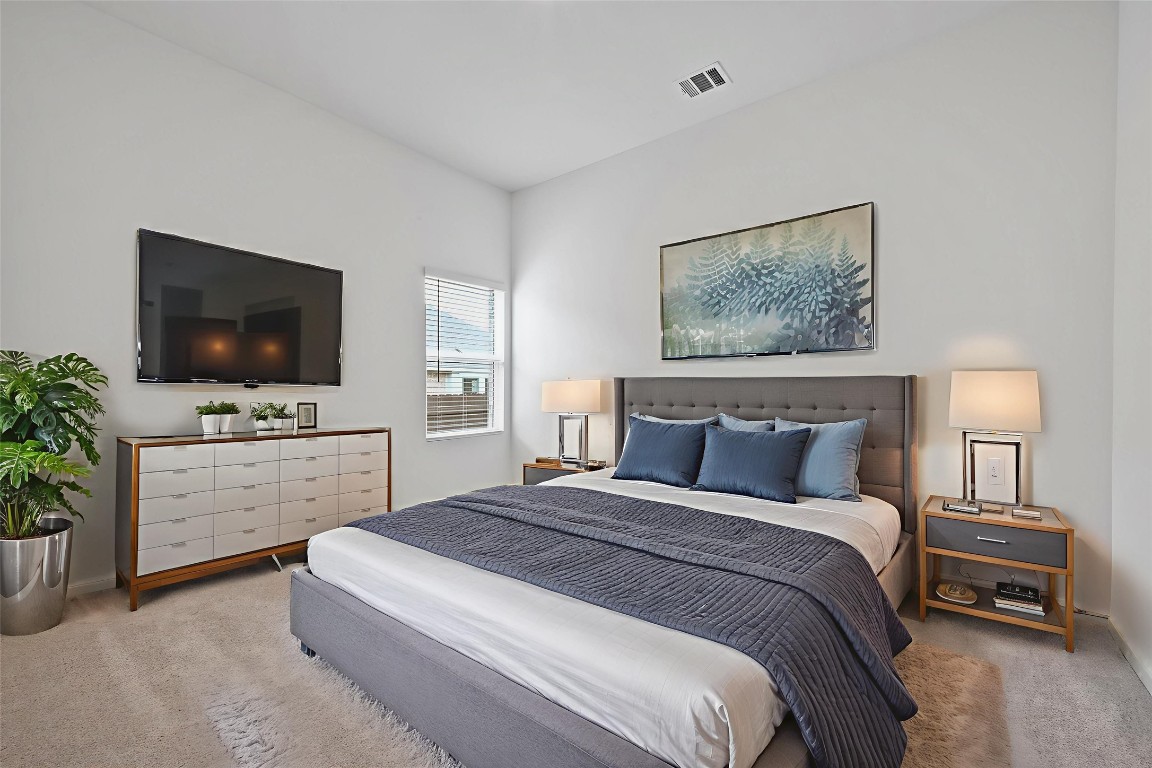 1617 Dove Rnch Road Georgetown, TX 78628 - Photo 18 of 25 a bedroom with a bed and a flat screen tv