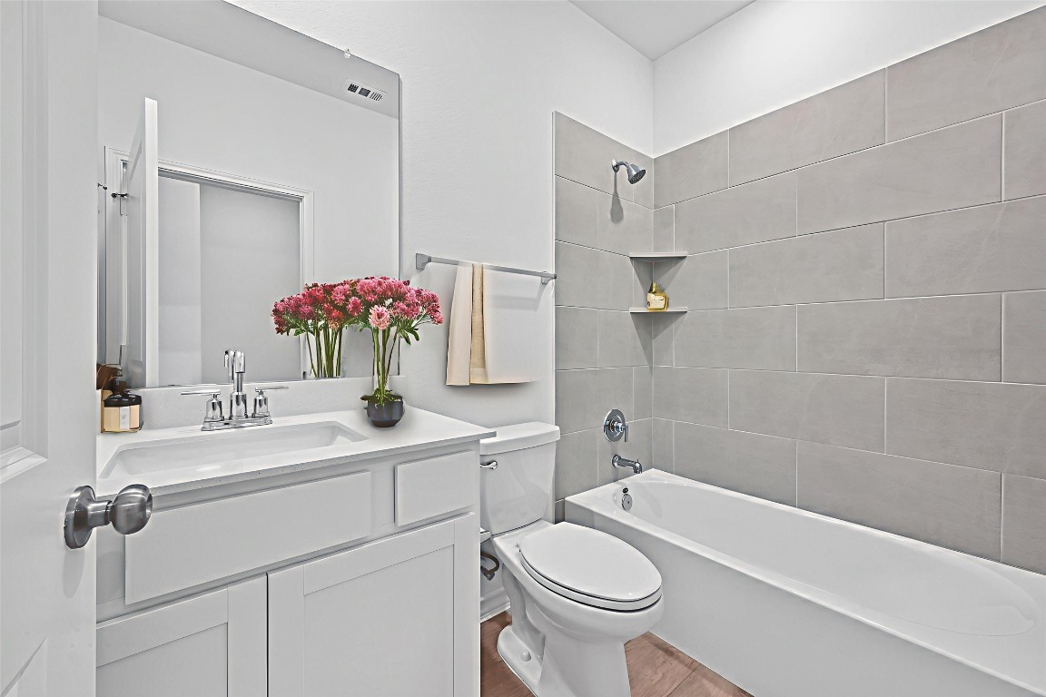 1617 Dove Rnch Road Georgetown, TX 78628 - Photo 19 of 25 a bathroom with a sink a toilet and shower