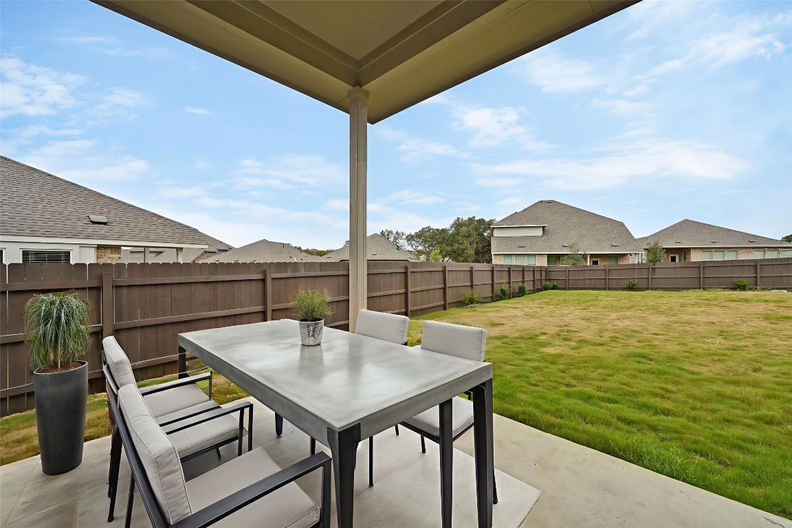 1617 Dove Rnch Road Georgetown, TX 78628 - Photo 20 of 25 a view of a balcony with table and chairs