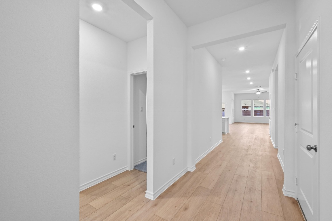 1617 Dove Rnch Road Georgetown, TX 78628 - Photo 4 of 25 a view of a hallway with wooden floor