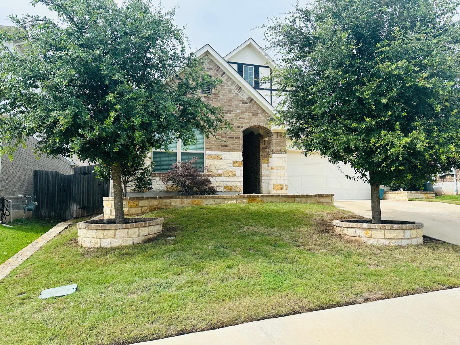 862 Leadtree Loop Buda, TX 78610 - Photo 37 of 40 a front view of a house with a yard