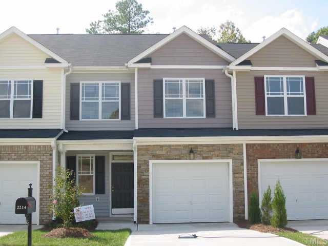 2214 Stoney Spring Drive Raleigh, NC 27610 - Photo 1 of 1 a front view of a house with a yard and garage