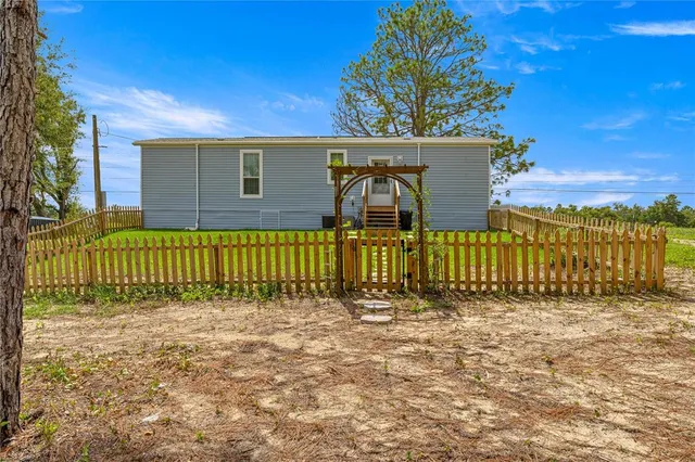 a utility room with sink dryer and washer