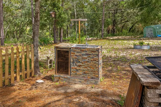 a row of palm trees in front of house