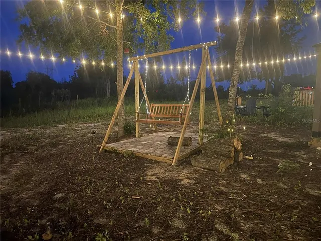 a wooden deck with large trees