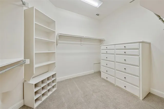a view of an empty walk in closet