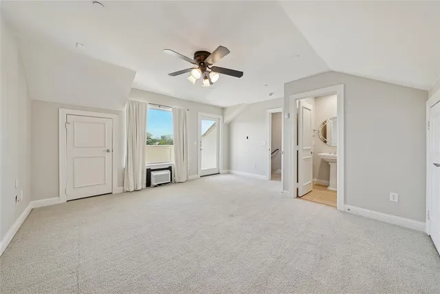 a view of empty room with closet and ceiling fan