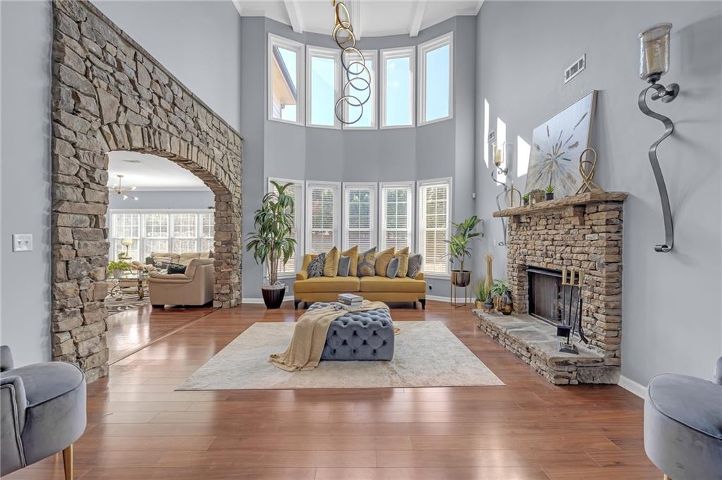 604 Arbor Ridge Loganville, GA 30052 - Photo 12 of 39 a living room with furniture and a fireplace